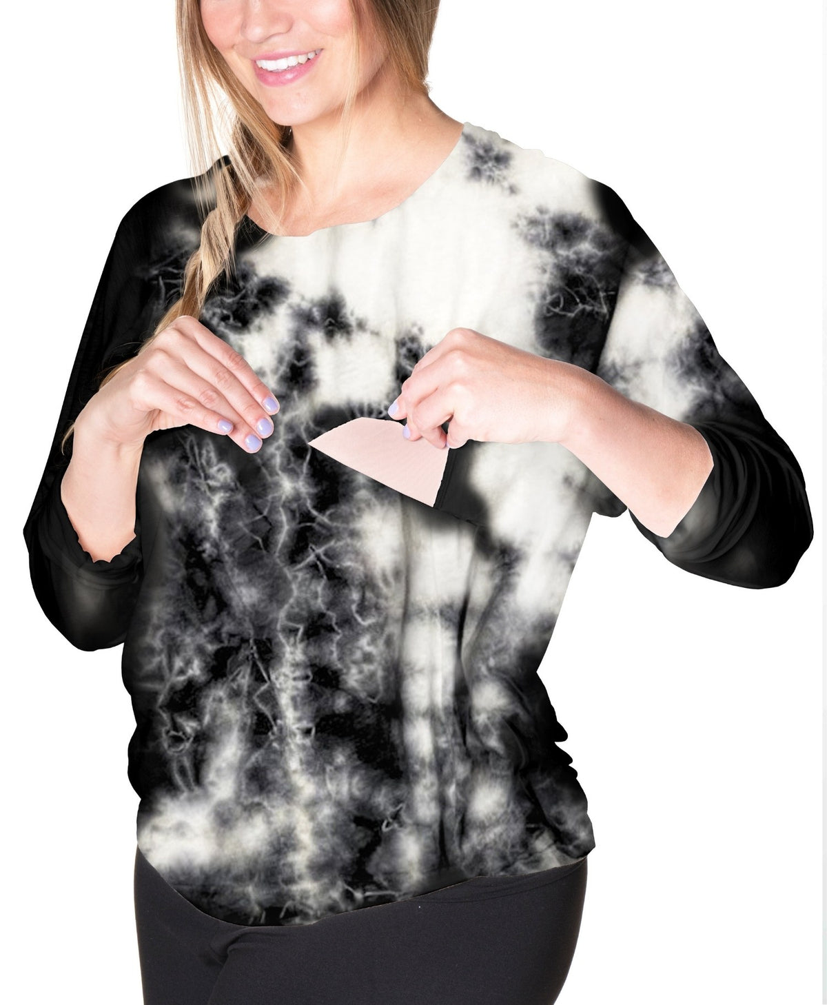 Person wearing a black and white tie-dye nursing long sleeve shirt and showing the nursing feature